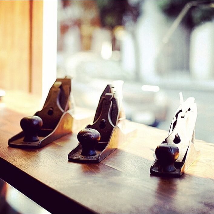 Three hand planes on a timber bench